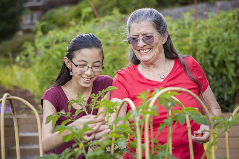 woman gardening with her grandchild