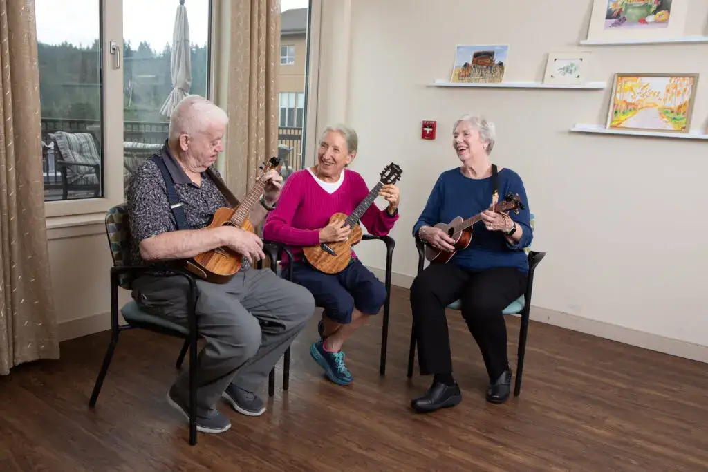 Timber Ridge residents gather together to play ukuleles in a community music room. One of the many resident favorite hobbies for seniors in Issaquah, WA.