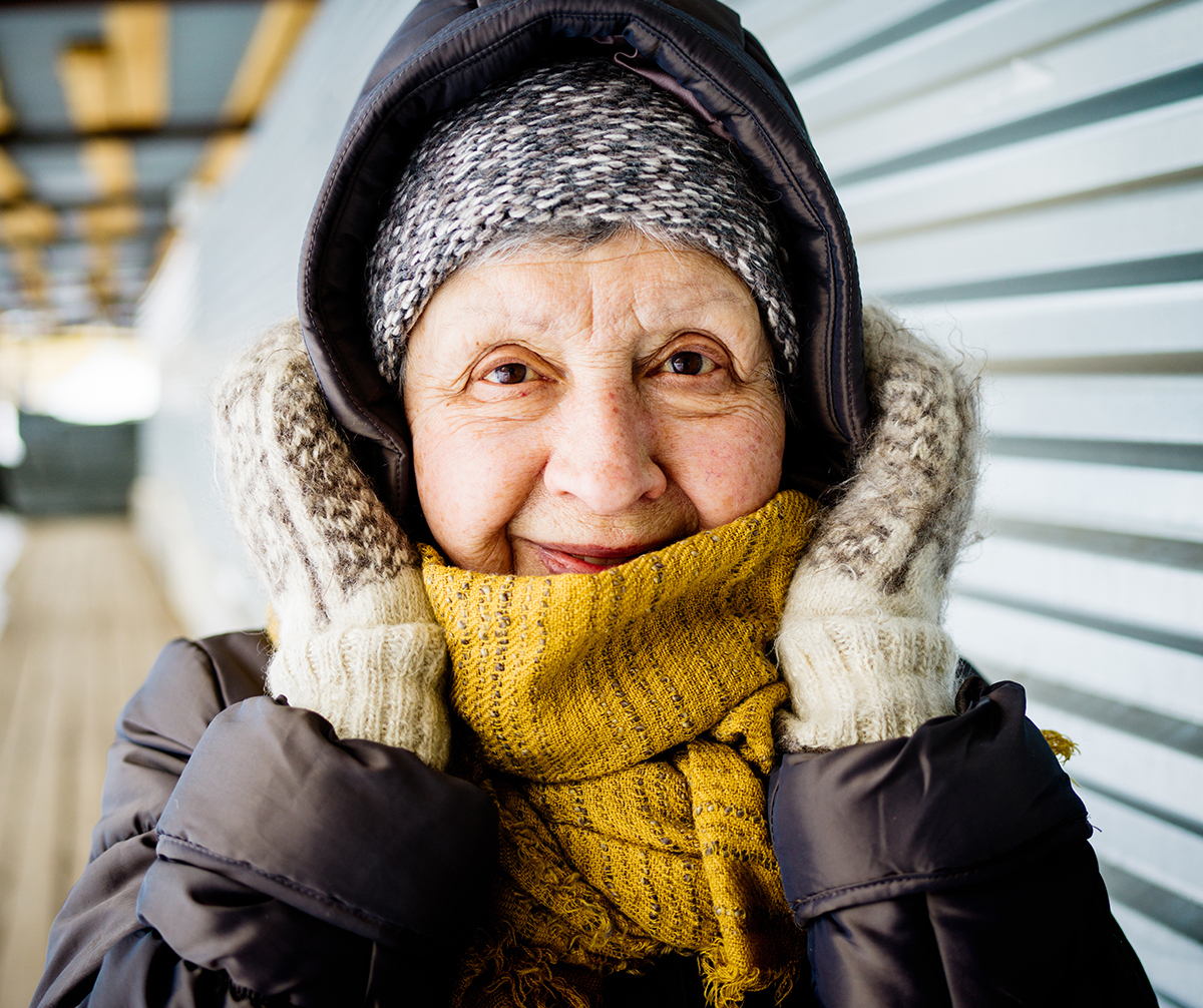 Elderly woman dressed in winter clothes