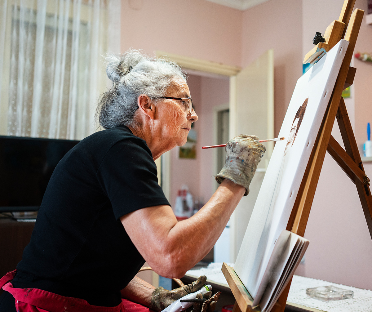 Older woman painting