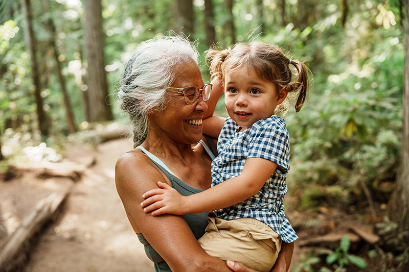 woman in nature with her grandchild