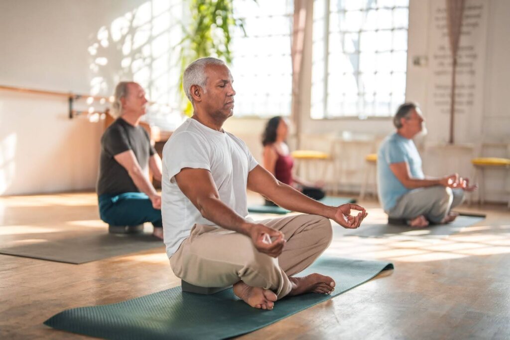 Group of seniors enjoying yoga class